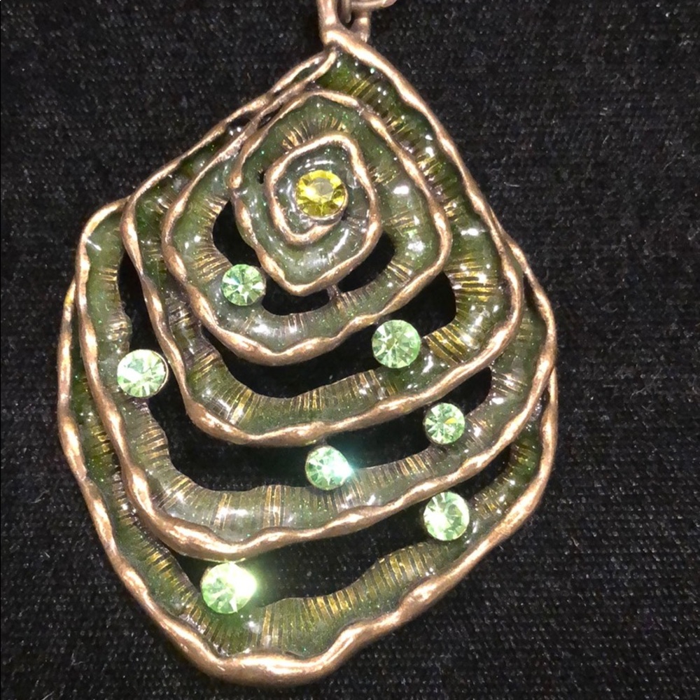 Aged antique gold metal w/ crystals painted green.